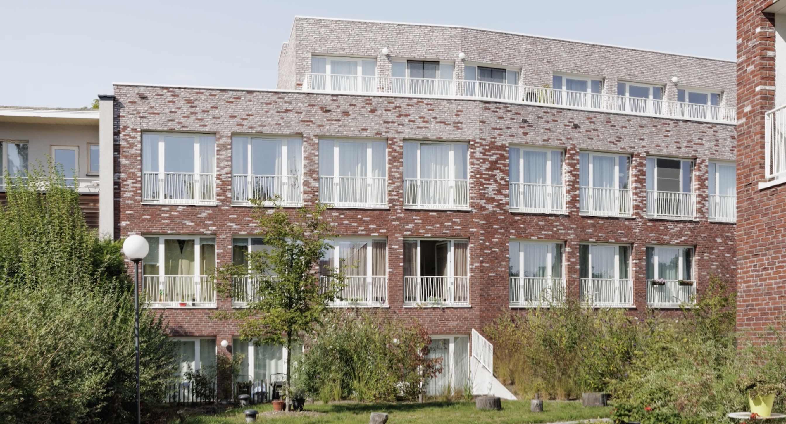 Sociale Huisvesting Mortsel bold architecten origami baksteenstructuur